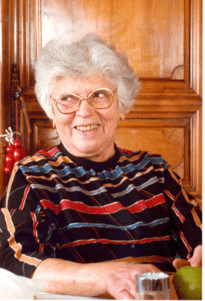 Andree Salomon seated at a table