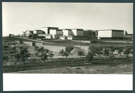 A group of flat-topped buildings on top of a hill