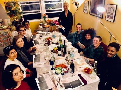 A group of people seated around a seder table. 