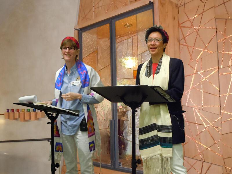 Two women on the bima at synagogue