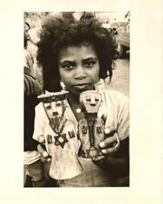 Ethiopian Jewish child with figurines. Around 1980.