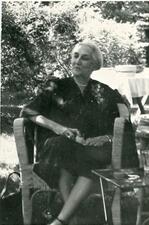 Amy Loveman seated outside