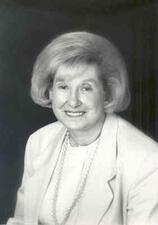 Headshot of Florence Levin Denmark wearing a blazer and smiling to the camera