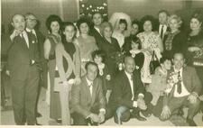 Zohra El Fassia, top right, in a large group photo at a wedding