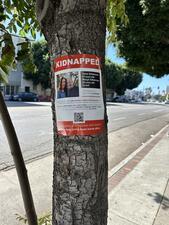 Sign that says Kidnapped and includes names and information about two Israelis kidnapped in Hamas attack on October 7