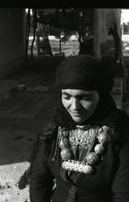 A woman wears jewelry handmade by a goldsmith in Hatzermat, Yemen. 1964. 