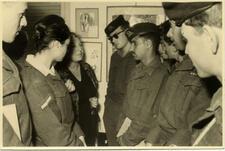 Black and white photograph of Miriam Novitch with soldiers