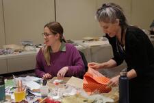 Alanna Davis and Michal Katz creating art at Full Disclosure Facilitators' Workshop