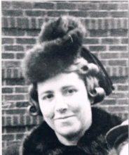 Irma Rothschild Jung in front of a brick wall, wearing a fur hat and coat