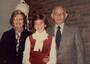 Carole Balin posing for a photo with her grandparents.