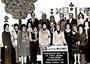 Black-and-white photo of a group of people with a sign reading "El Al Israel Airlines Welcomes Congregation Beth El South Orange"