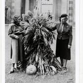 A younger woman and Adele Ginzberg holding a large bunch of reeds