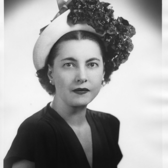 Studio portrait of Lilian Freehof wearing a flower hat