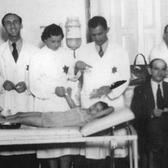 Nurses and Doctors Treat a Child in the Ghetto, Bedzin, Poland