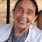 Cropped photo of Yehudit Arnon, sitting outdoors