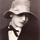 A portrait of Anita Brenner, wearing a hat with a wide brim bent to obscure her eyes