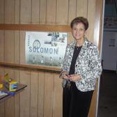 Carol Wise Beside JWA Poster in the Abandoned Congregation Beth Israel in Biloxi, June 21, 2007