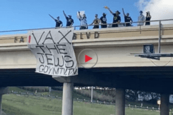 Neo-Nazis holding Vax the Jews banner in Austin