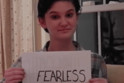 Caroline Kubzansky Holding "Fearless" Sign