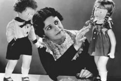 Beatrice Alexander Examining Dolls, circa 1920s