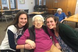 Elderly woman with two teenage girls