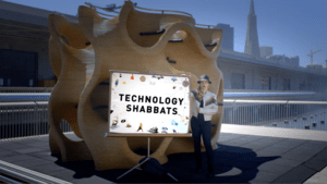 Tiffany Shlain with "Technology Shabbats" sign