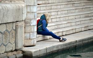 Teen Sitting on Steps of a Monument