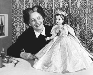 Beatrice Alexander Examining the Queen Elizabeth II Doll from the Coronation Set, 1953