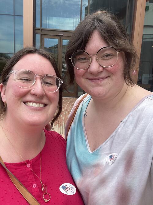 Two women wearing "I voted" stickers