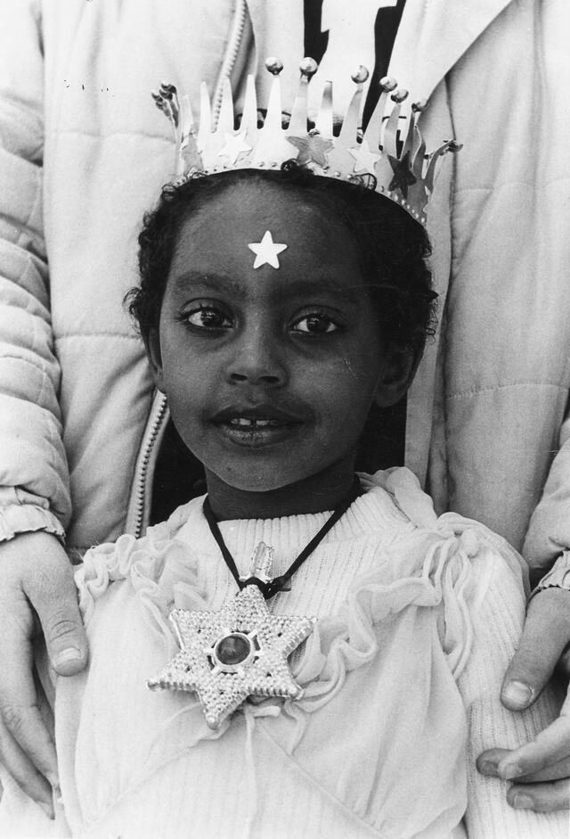 Ethiopian Jewish girl with star of David necklace and crown.