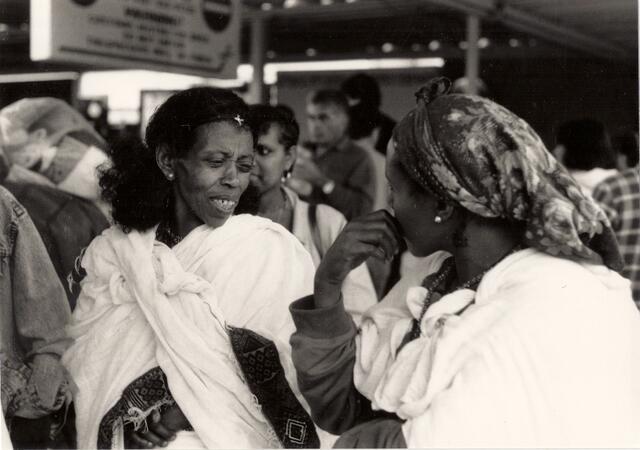 Ethiopian Jews at the airport immigrating to Israel. Around 1980. 