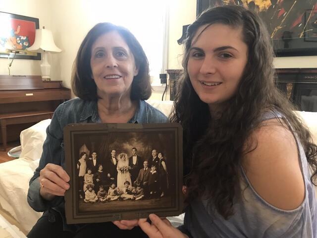 Elizabeth Danon holding family photo