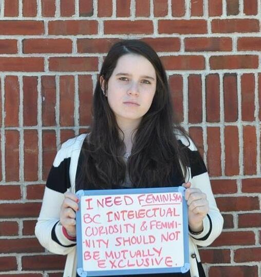 Maya Holding a Femininjas Sign