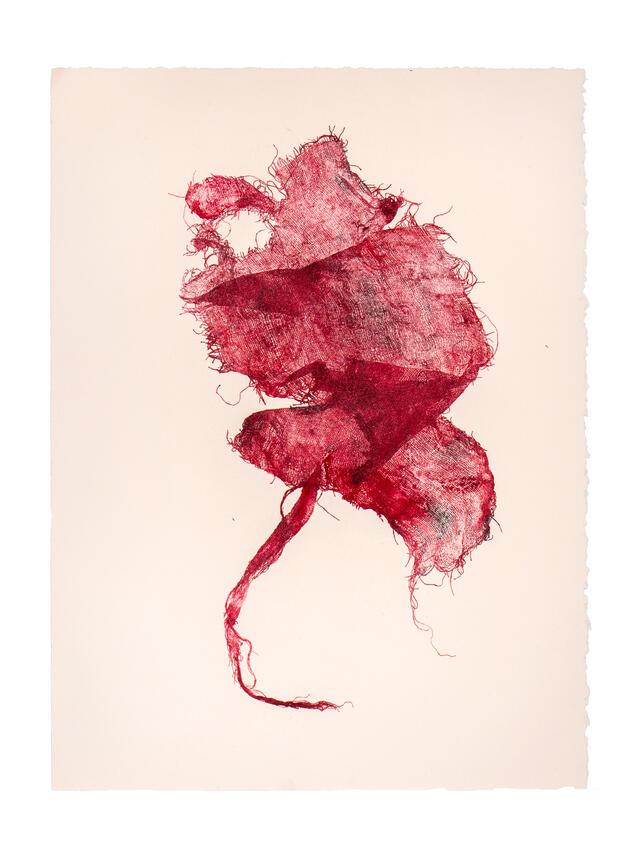 Image of dark red inkblot on off-white paper