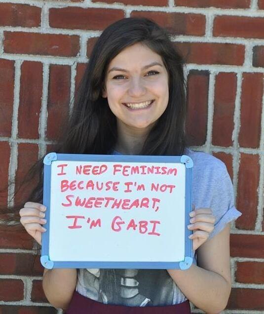 Gabi Holding Femininjas Sign