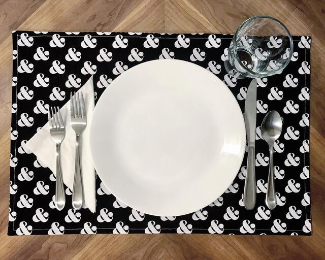 Place setting with "&"-Themed Placemat