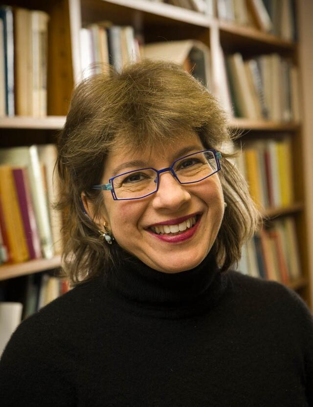 Susannah Heschel with bookshelves in the background. 